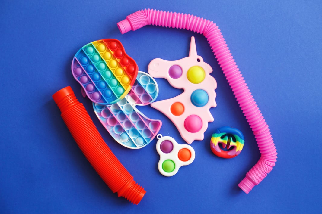 Colorful Antistress Sensory Fidget Toys on a Blue Background